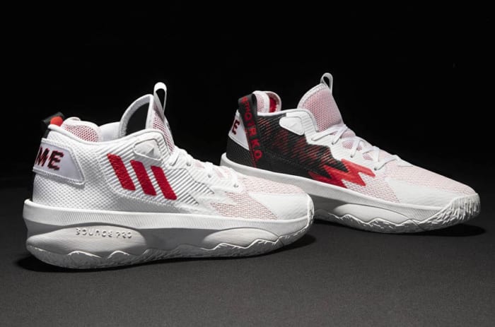 White, red, black Adidas Dame shoes.